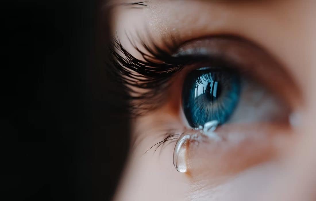 A tear rolling down a face